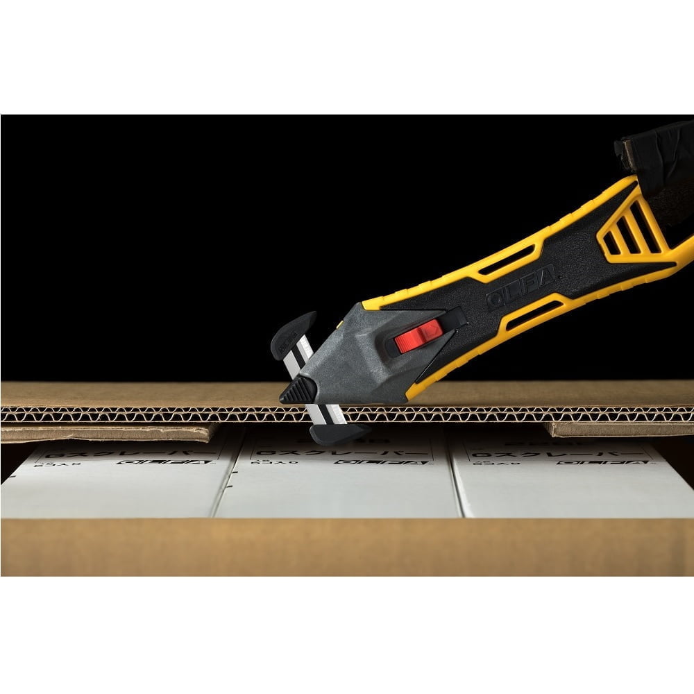 cutter galben cu cap de taiere schimbabil negru  taie o cutie de carton